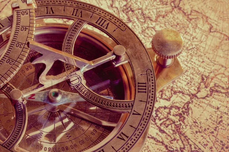 Old compass over ancient map Free Photo