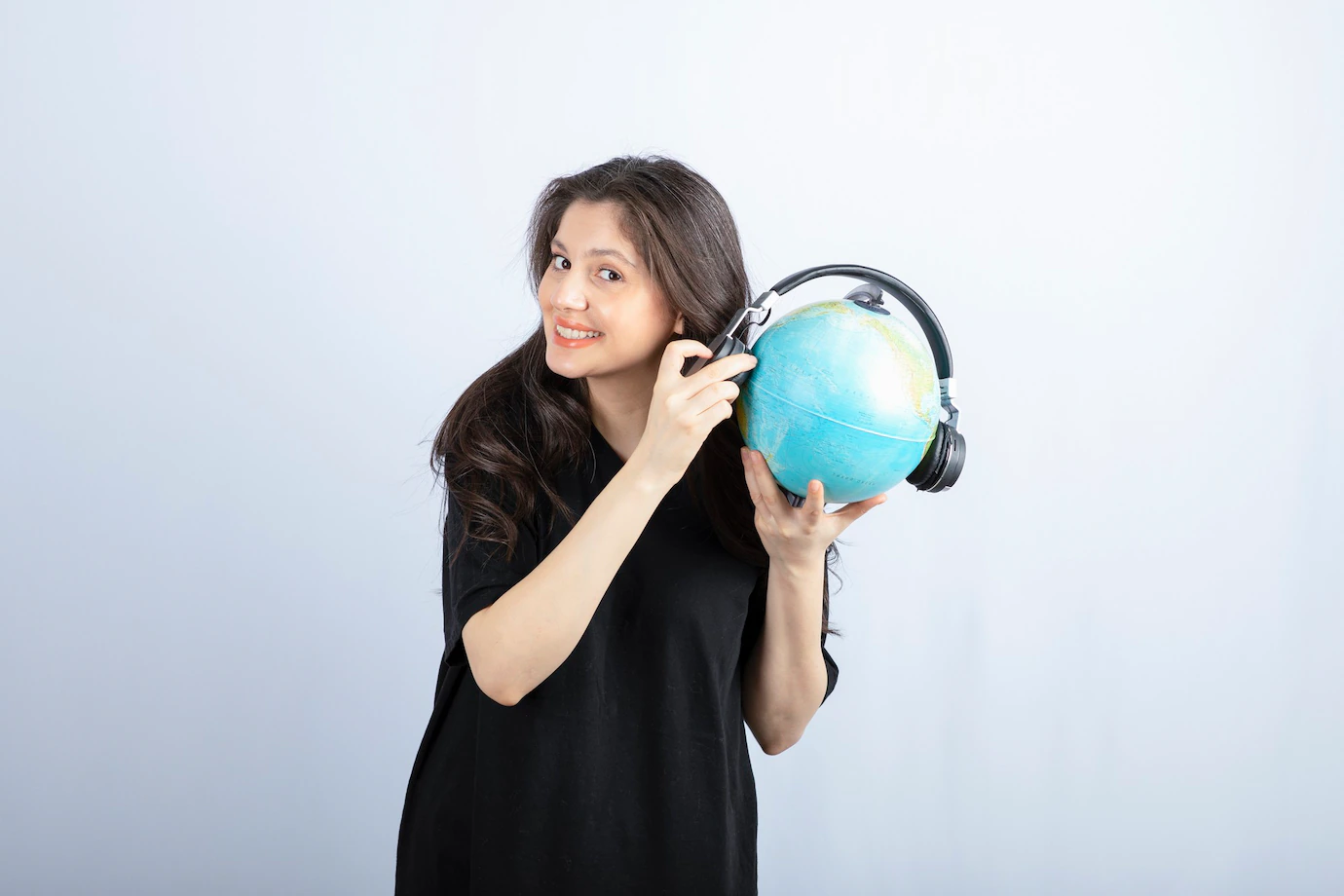 Smiling Beautiful Young Woman Standing Holding Globe Headphones 114579 47799