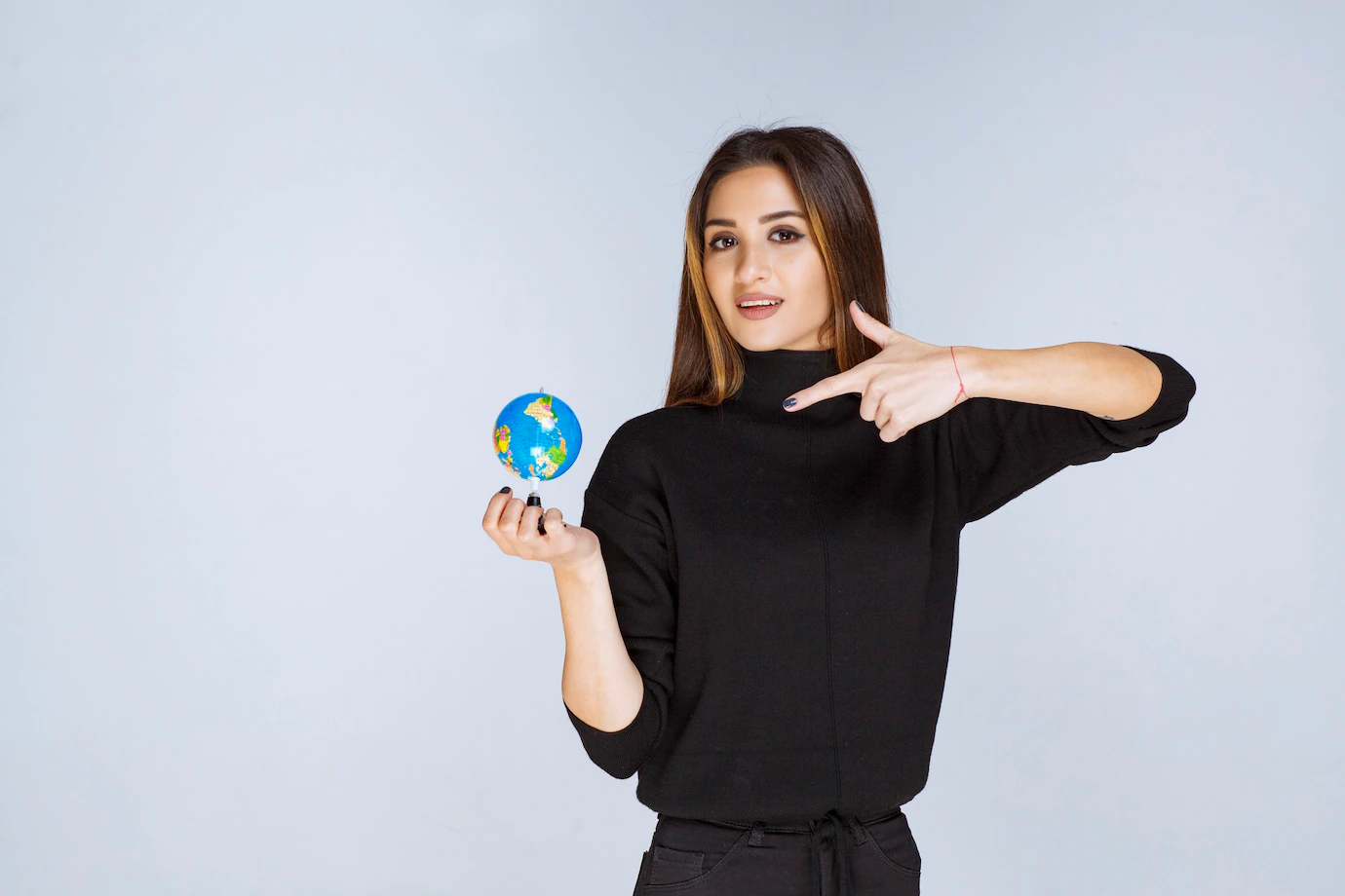 Woman Holding Mini Globe Finding Locations It 144627 60792