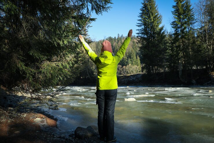 Woman waving at the river Free image download