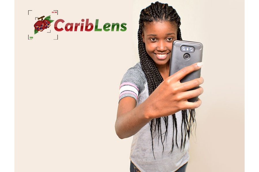African black girl taking selfie with phone in front of her face
