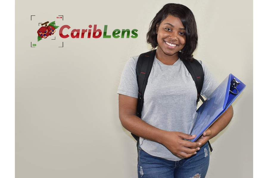 Black African school girl student holding blue folder in hands